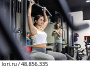 Woman is engaged in a simulator for development of back muscles. Стоковое фото, фотограф Яков Филимонов / Фотобанк Лори