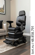 A black power wheelchair with a comfortable padded seat and a headrest sits on a patterned rug in a modern living room. Стоковое AI-изображение, AI-художник Данила Большаков / Фотобанк Лори
