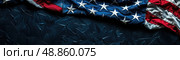 A close-up shot of an American flag draped over a dark blue surface, with the stars and stripes visible. The flag is slightly crumpled, creating a sense of movement. Стоковое AI-изображение, AI-художник Данила Большаков / Фотобанк Лори