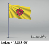 Waving flag of Lancashire - county of England on flagpole. Templ. Стоковая иллюстрация, иллюстратор Максим Гребешков / Фотобанк Лори
