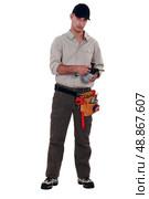 Plumber with blowtorch, studio shot. Стоковое фото, агентство Ingram Publishing / Фотобанк Лори