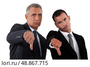businessmen, thumbs down. Стоковое фото, агентство Ingram Publishing / Фотобанк Лори