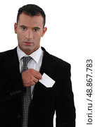 businessman sticking out business card. Стоковое фото, агентство Ingram Publishing / Фотобанк Лори