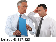 Businessman reprimanding his employee. Стоковое фото, агентство Ingram Publishing / Фотобанк Лори