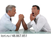 Pretentious young man assuming he will be victorious. Стоковое фото, агентство Ingram Publishing / Фотобанк Лори