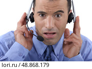 Call centre operator looking shocked. Стоковое фото, агентство Ingram Publishing / Фотобанк Лори