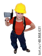 Female laborer holding blowtorch. Стоковое фото, агентство Ingram Publishing / Фотобанк Лори