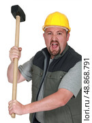 Tradesman holding a mallet. Стоковое фото, агентство Ingram Publishing / Фотобанк Лори