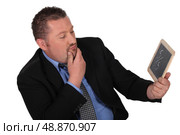 Man looking at blackboard. Стоковое фото, агентство Ingram Publishing / Фотобанк Лори
