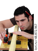 woodworker working on a board. Стоковое фото, агентство Ingram Publishing / Фотобанк Лори