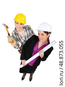 High-angle shot of a tradeswoman standing next to an engineer. Стоковое фото, агентство Ingram Publishing / Фотобанк Лори