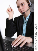 Manicured executive with a laptop and headset. Стоковое фото, агентство Ingram Publishing / Фотобанк Лори