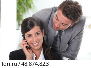 Man flirting with his colleague. Стоковое фото, агентство Ingram Publishing / Фотобанк Лори