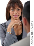 Businesswoman interviewing an applicant. Стоковое фото, агентство Ingram Publishing / Фотобанк Лори