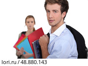 Two students carrying schoolwork. Стоковое фото, агентство Ingram Publishing / Фотобанк Лори