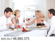 Two couples enjoying meal. Стоковое фото, агентство Ingram Publishing / Фотобанк Лори