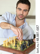 Man playing chess. Стоковое фото, агентство Ingram Publishing / Фотобанк Лори