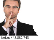 Smart man asking for silence. Стоковое фото, агентство Ingram Publishing / Фотобанк Лори