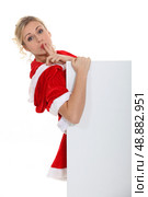 Woman with her finger on her lips. Стоковое фото, агентство Ingram Publishing / Фотобанк Лори