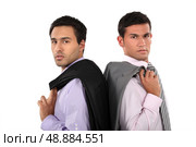 Businessmen standing back to back. Стоковое фото, агентство Ingram Publishing / Фотобанк Лори