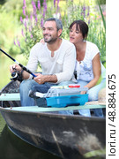 a couple fishing on a boat. Стоковое фото, агентство Ingram Publishing / Фотобанк Лори