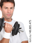 Man lifting a dumbbell. Стоковое фото, агентство Ingram Publishing / Фотобанк Лори