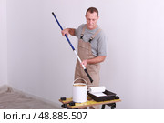 a house painter working. Стоковое фото, агентство Ingram Publishing / Фотобанк Лори