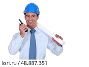Architect with a walkie-talkie. Стоковое фото, агентство Ingram Publishing / Фотобанк Лори