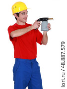 Tradesman holding a blowtorch. Стоковое фото, агентство Ingram Publishing / Фотобанк Лори