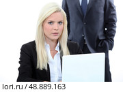 Blonde woman and a man behind. Стоковое фото, агентство Ingram Publishing / Фотобанк Лори