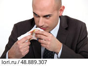 bad man smelling money. Стоковое фото, агентство Ingram Publishing / Фотобанк Лори