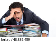 Stressed man under lots of pressure at work. Стоковое фото, агентство Ingram Publishing / Фотобанк Лори