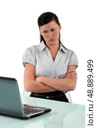 Female office worked looking annoyed. Стоковое фото, агентство Ingram Publishing / Фотобанк Лори