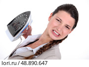 A businesswoman unhappy with her ironing. Стоковое фото, агентство Ingram Publishing / Фотобанк Лори