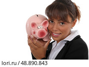 Woman with a piggy bank in hand. Стоковое фото, агентство Ingram Publishing / Фотобанк Лори