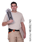 Tiler to tile cutting machine. Стоковое фото, агентство Ingram Publishing / Фотобанк Лори