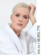 Stunning blonde woman in full make up and a toweling robe. Стоковое фото, агентство Ingram Publishing / Фотобанк Лори