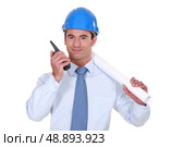 Architect with a two-way radio. Стоковое фото, агентство Ingram Publishing / Фотобанк Лори