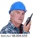 Foreman with radio receiver. Стоковое фото, агентство Ingram Publishing / Фотобанк Лори