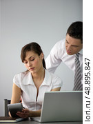 Business couple going over accounts. Стоковое фото, агентство Ingram Publishing / Фотобанк Лори