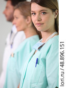 A nurse and her coworkers. Стоковое фото, агентство Ingram Publishing / Фотобанк Лори