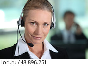 Woman smiling with headset. Стоковое фото, агентство Ingram Publishing / Фотобанк Лори