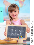 Show girl in school board. Стоковое фото, агентство Ingram Publishing / Фотобанк Лори