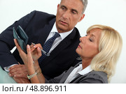middleaged businessman with female counterpart. Стоковое фото, агентство Ingram Publishing / Фотобанк Лори