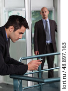 Man making a personal call at work. Стоковое фото, агентство Ingram Publishing / Фотобанк Лори