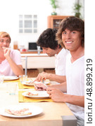 portrait of three friends at table. Стоковое фото, агентство Ingram Publishing / Фотобанк Лори