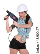 sexy woman using a power drill. Стоковое фото, агентство Ingram Publishing / Фотобанк Лори