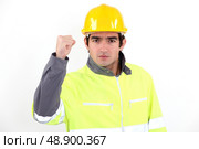 Angry builder waving fist. Стоковое фото, агентство Ingram Publishing / Фотобанк Лори
