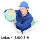 Tradesman holding a globe. Стоковое фото, агентство Ingram Publishing / Фотобанк Лори