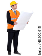 Engineer verifying a drawing. Стоковое фото, агентство Ingram Publishing / Фотобанк Лори
